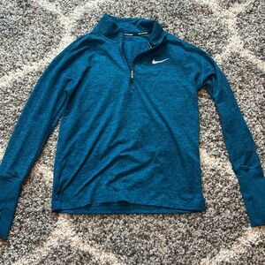 Nike blue running quarter zip size XS in great conditiont condition.